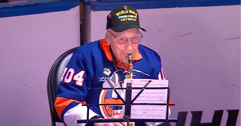 'USA!' chants erupt as WWII veteran, 104, nails National Anthem on sax before Rangers-Islanders game