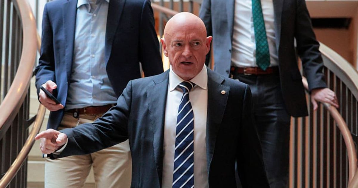 Mark Kelly posted a video of himself on X declaring his New Year's resolution, asserting that it is 'not right' for elected officials to profit from the stock market (Chip Somodevilla/Getty Images)