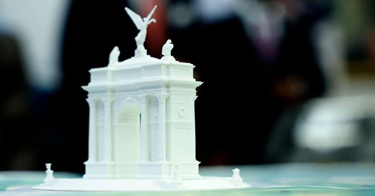 Critics of the 'Triumphal Arch' project questioned its cost, authority, and impact, while Donald Trump showcased scale models to rally support (Getty Images) 