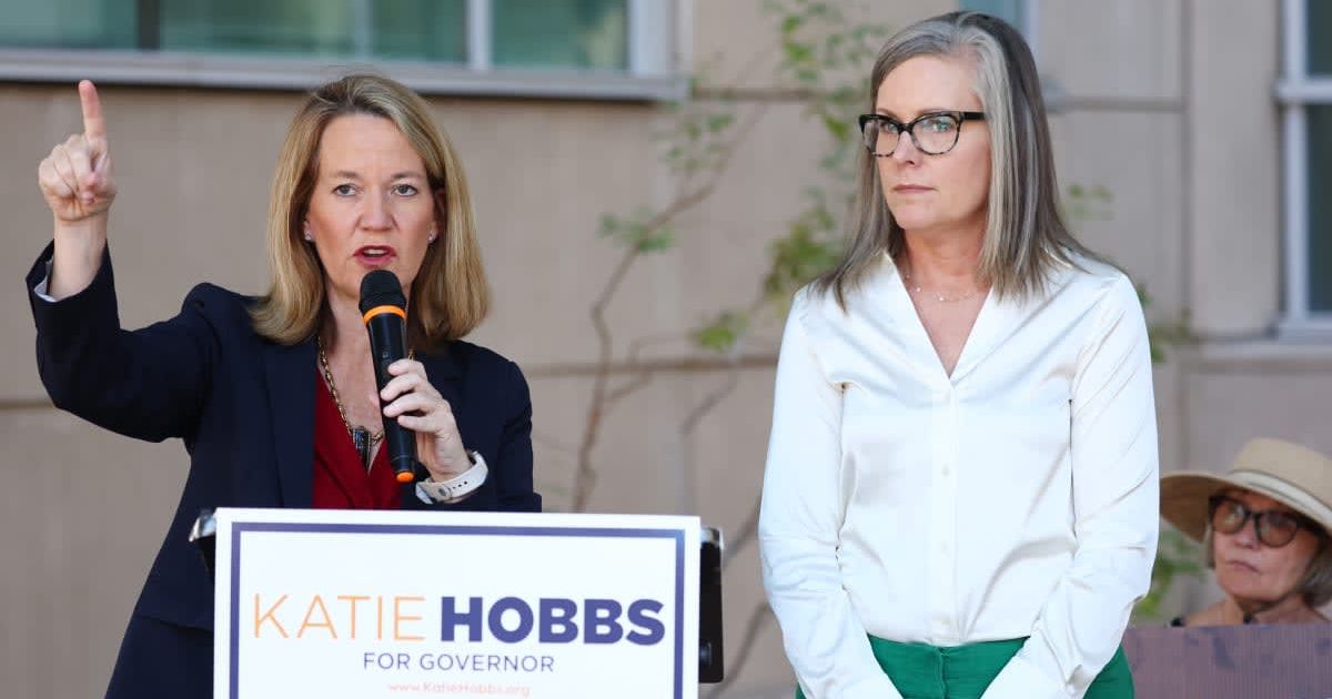 Arizona Secretary of State and Democratic gubernatorial candidate Katie Hobbs looks on as Kris Mayes, Democratic candidate for Arizona attorney general, speaks at a press conference (Getty Images) 