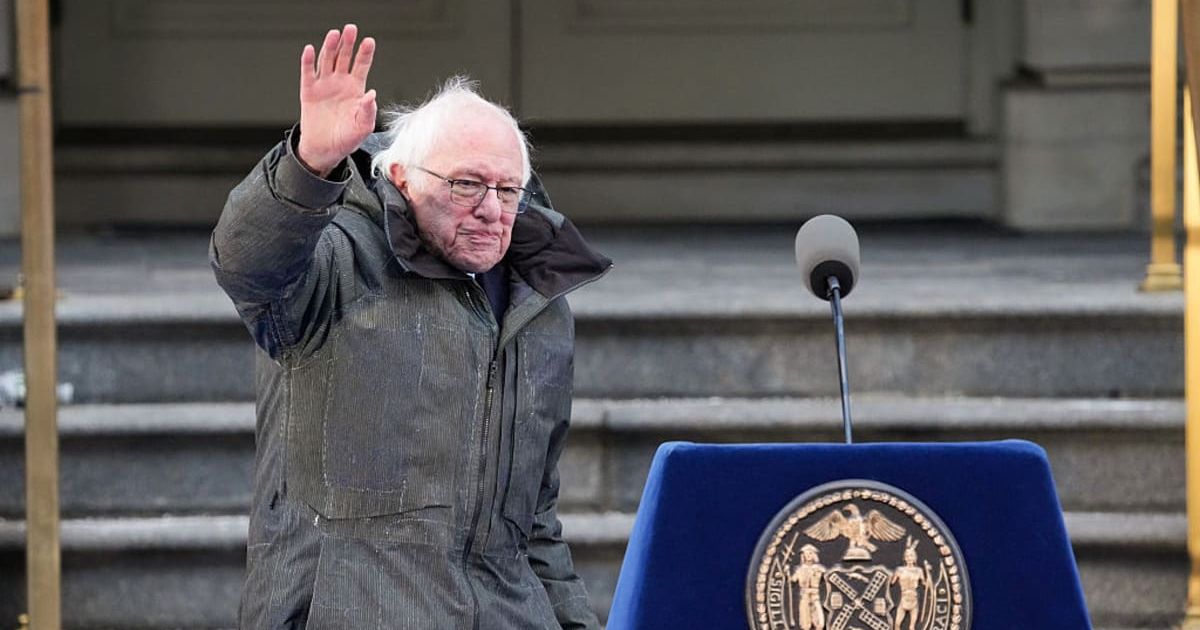 Senator Bernie Sanders waves to the crowd at Zohran Mamdani's inauguration as the 112th mayor at City Hall on January 1, 2026, in New York (David Dee Delgado/Getty Images)