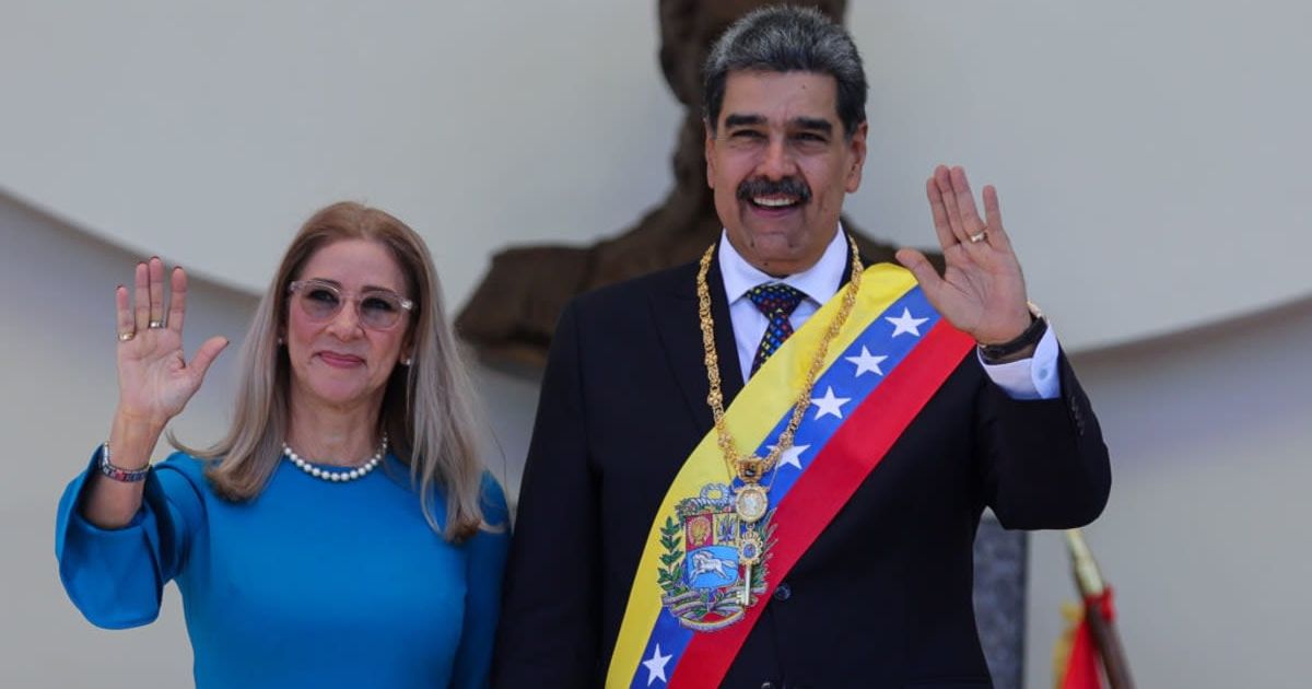 President of Venezuela Nicolas Maduro and his wife Cilia Flores hold hands and pose for photos after the swearing-in ceremony at Palacio Federal Legislativo on January 10, 2025 in Caracas, Venezuela (Getty Images)