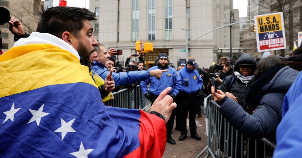 People protest outside Manhattan Federal Court before the arraignment of Venezuelan President Nicolas Maduro, Monday, January 5, 2026, in New York (AP Photo/Stefan Jeremiah)