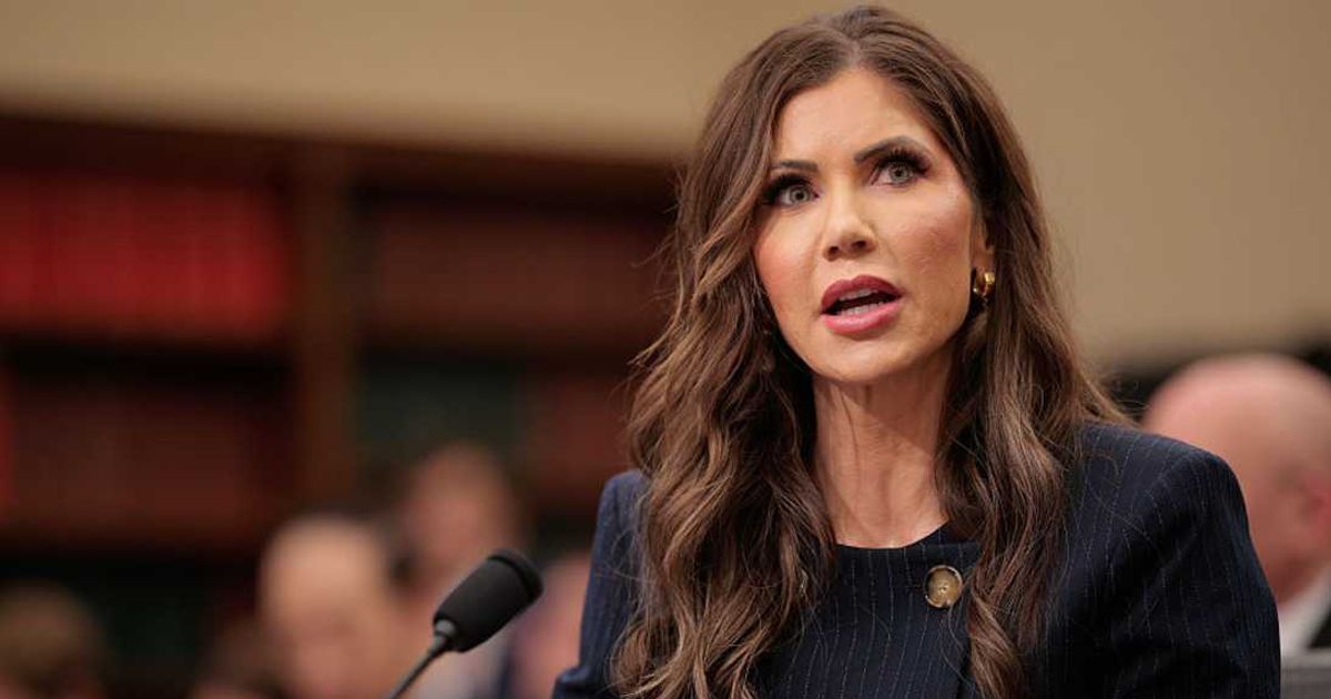 Kristi Noem said ICE officers were blocked by a hostile crowd after their vehicle stalled, and later focused on a woman in an SUV obstructing their exit (Getty Images)