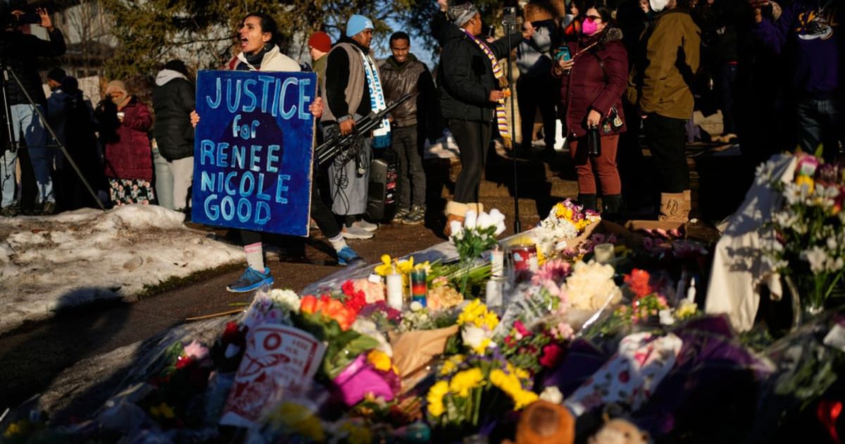 Nour Tamimi, right, leads a chant during a rally at a makeshift memorial honoring Renee Good, who was fatally shot by an ICE officer, near the site of the shooting in Minneapolis, Friday, Jan 9, 2026 (AP Photo/John Locher)