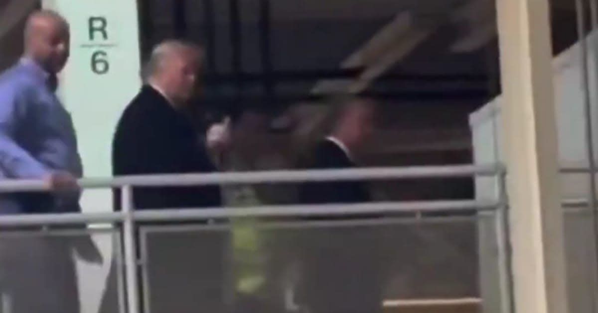 President Donald Trump appeared to flip off a person during his visit to Michigan (Screengrab/@rawsalerts/X)
