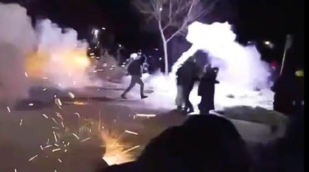 Anti-ICE protesters flee as federal agents deploy tear gas and flash bangs in Minneapolis