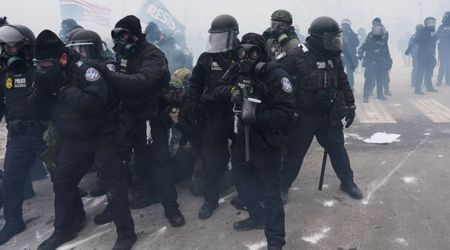 Agents use force and warnings to control anti-ICE protest outside Minneapolis federal building