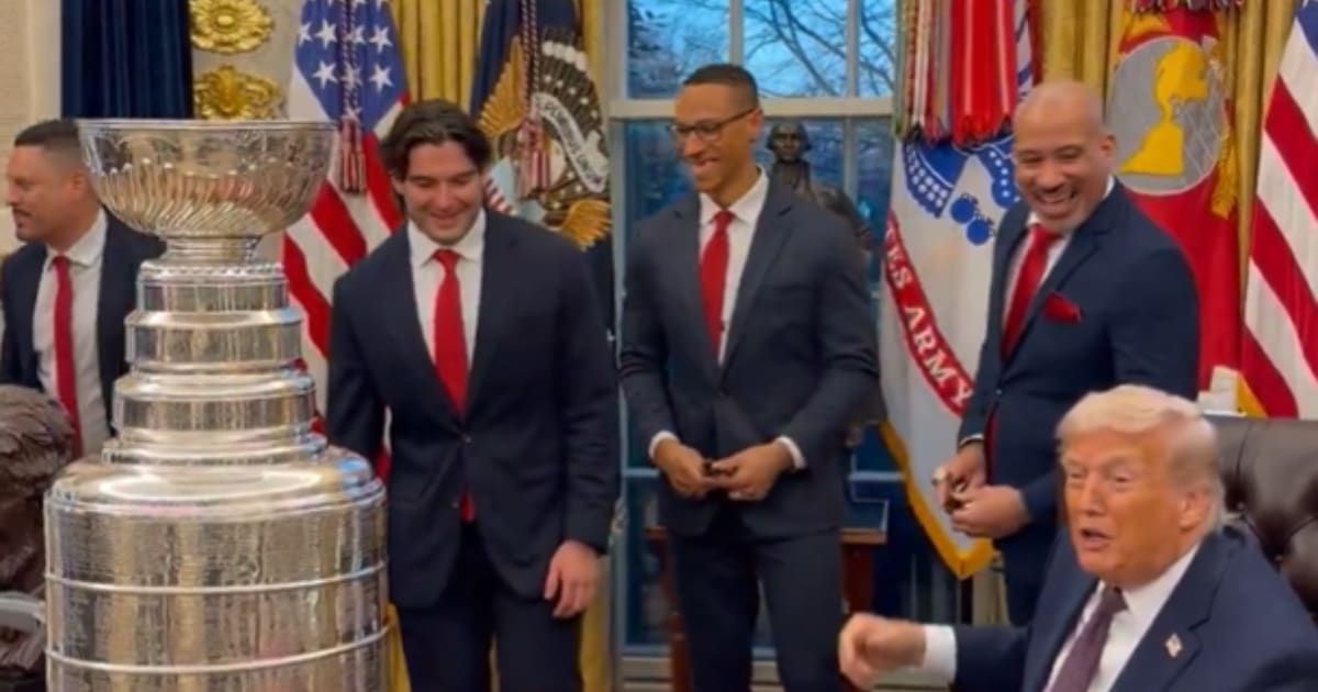 President Trump jokes about a player's teeth as he hands out presidential sharpies and coins to the Florida Panthers on Jan 15 at the Oval Office (@MargoMartin47/X)