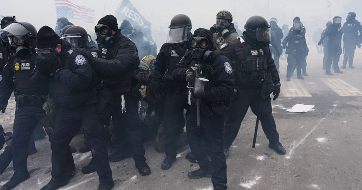 Protests erupted after Renee Nicole Good was killed by an ICE agent, and federal agents later used tear gas and grenades to disperse crowds (AP Photo/Adam Gray)