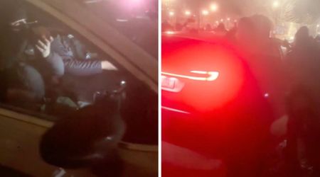 ICE agent points pistol at protesters as they hit, bash government vehicle in tense video