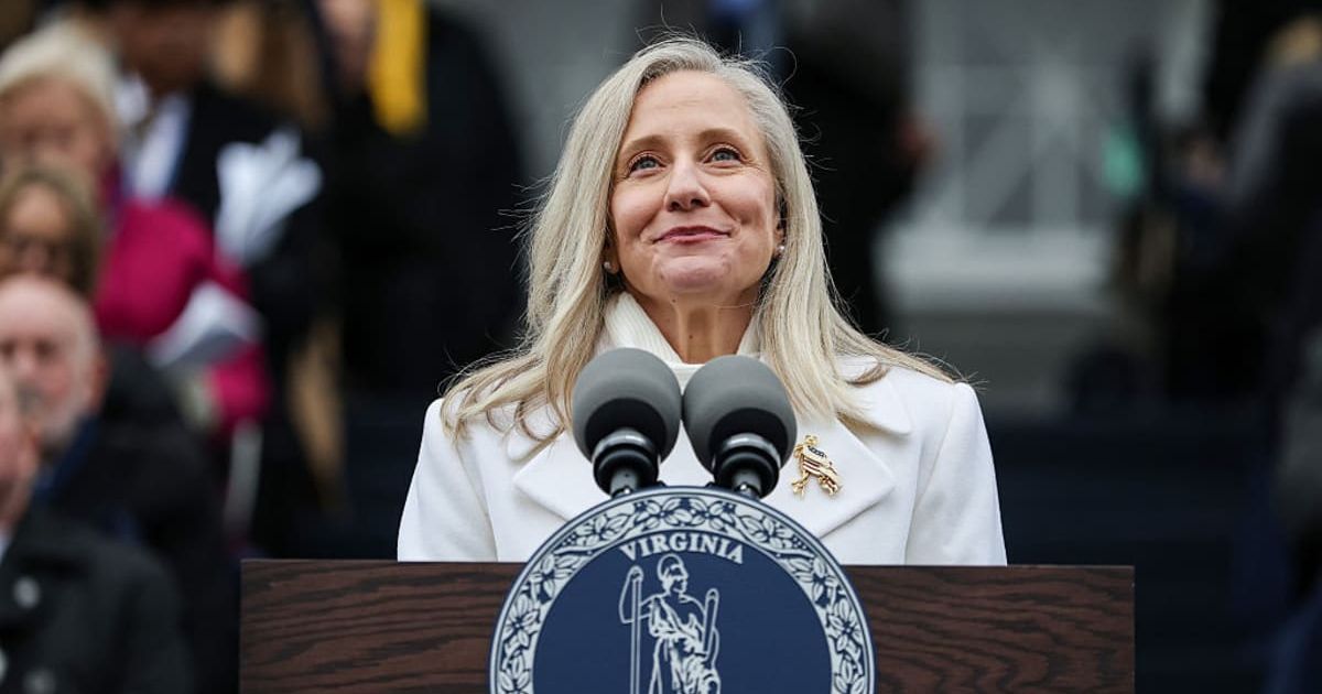 Abigail Spanberger wore a white outfit for her inauguration ceremony, and her choice of attire symbolized women's suffrage, blending tradition with a powerful visual statement (Win McNamee/Getty Images)