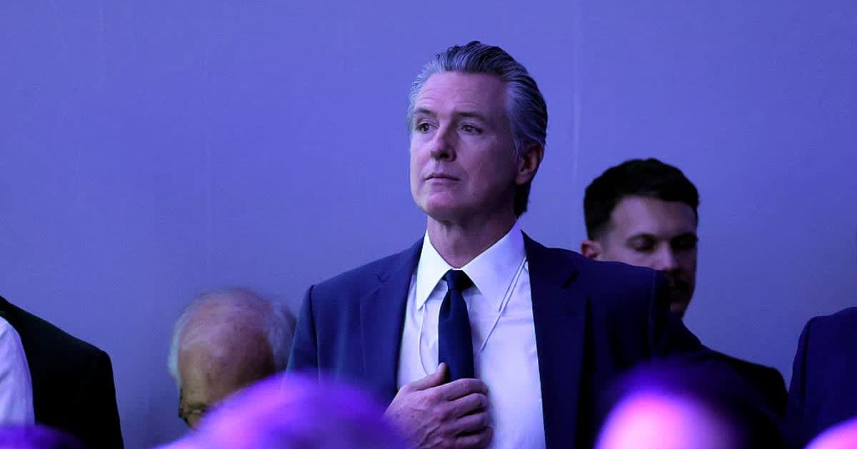 Gavin Newsom, the governor of California, watches as President Donald Trump gives a speech at the World Economic Forum (WEF) on January 21, 2026 in Davos, Switzerland (Chip Somodevilla/Getty Images)