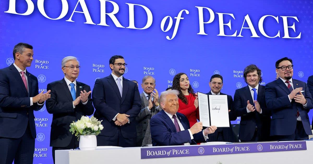 President Donald Trump holds up his signature on the founding charter during a signing ceremony for the 'Board of Peace' at the World Economic Forum (WEF) on January 22, 2026, in Davos, Switzerland (Getty Images)