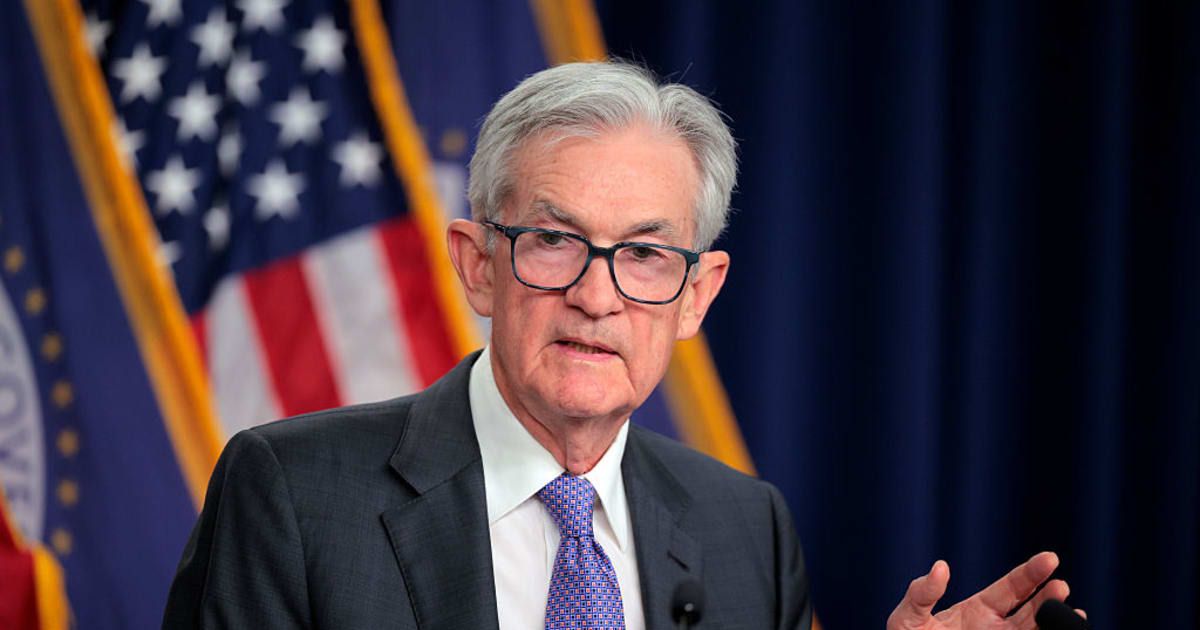 The Federal Reserve held rates steady during political turmoil, as Chair Jerome Powell confronted President Donald Trump's pressure, DOJ subpoenas, and a Supreme Court challenge (Getty Images)