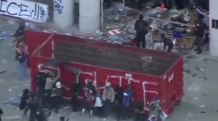 Anti‑ICE protesters use dumpster to block DTLA federal building as they clash with officers