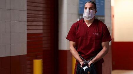 Patriots’ Mack Hollins shows up to Super Bowl LX in prison jumpsuit, mask and shackles