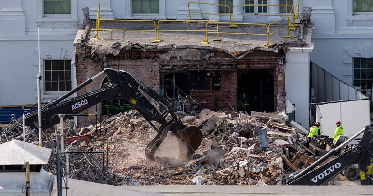 An excavator works to clear rubble after the East Wing of the White House was demolished on October 23, 2025, in Washington, DC (Getty Images)