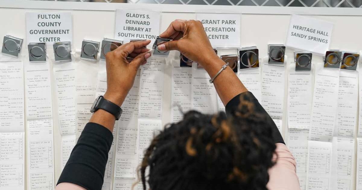 Receipts from early voting were brought out during election night at the Fulton County Elections Hub and Operation Center on November 5, 2024, in Fairburn, Georgia (Megan Varner/Getty Images)