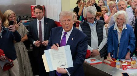 ‘Mine’s not an autopen’: Trump strikes out Biden’s signature, hand-signs Presidential Award