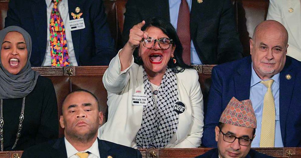 Rep Rashida Tlaib (D-MI) and Rep Ilhan Omar (D-MI) shout during President Donald Trump's State of the Union address at the US Capitol on February 24, 2026, in Washington, DC (Getty Images)