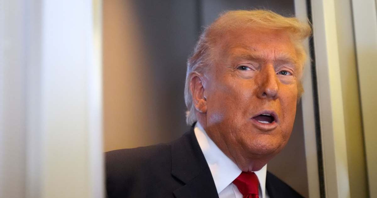 Donald Trump speaks with reporters aboard Air Force One while flying from Dover Air Force Base to Miami on March 7, 2026 (AP Photo/Mark Schiefelbein)