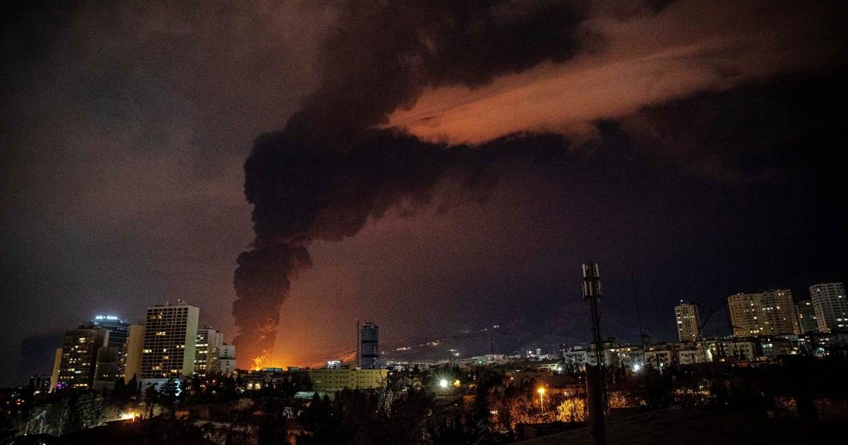 Flames and smoke billow from an oil storage facility after strikes hit Tehran, Iran, during the US–Israeli military campaign late March 7, 2026 (Alireza Sotakbar/ISNA via AP)