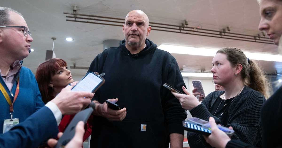 Senator John Fetterman speaks to reporters following votes at the Capitol, March 5, 2026, in Washington (AP Photo/Allison Robbert)