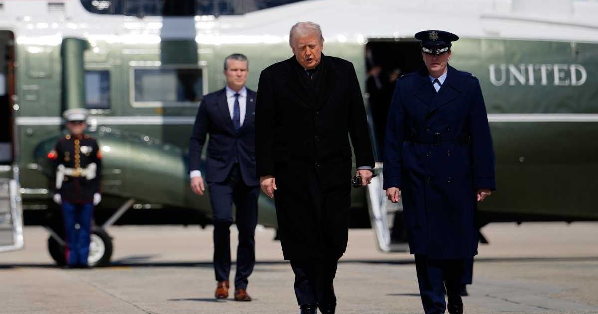 President Donald Trump and Defense Secretary Pete Hegseth, are escorted as they walk to board Air Force One, Wednesday, March 18, 2026, at Joint Base Andrews, Md (AP Photo/Julia Demaree Nikhinson)
