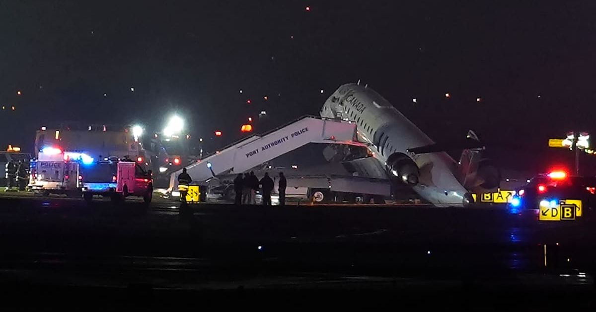 An Air Canada Jet sits on the runway at LaGuardia Airport, Monday, March 23, 2026, after colliding with a Port Authority vehicle in New York (AP Photo/Ryan Murphy)