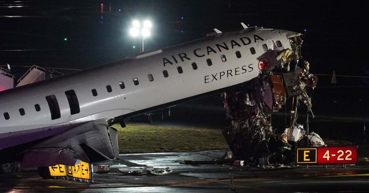 An Air Canada Jet sits on the runway at LaGuardia Airport, Monday, March 23, 2026, after colliding with a Port Authority aircraft rescue and firefighting vehicle after landing in New York (AP Photo/Ryan Murphy)