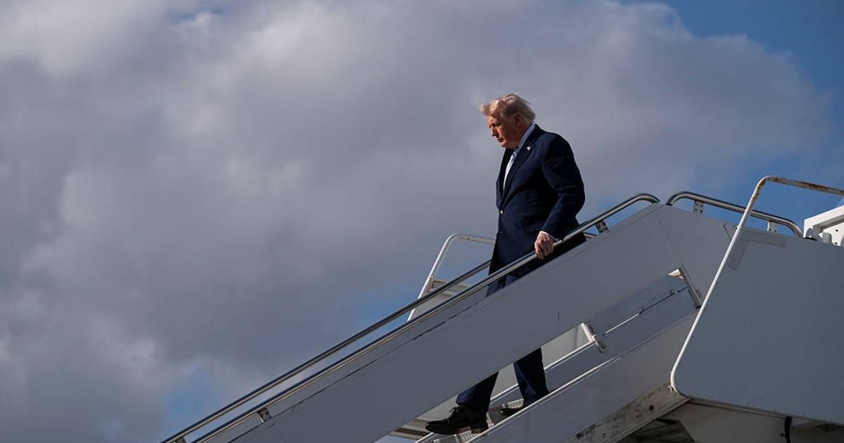 President Donald Trump exits Air Force One after landing at Palm Beach International Airport on March 20, 2026, in Palm Beach, Florida (Roberto Schmidt/Getty Images)