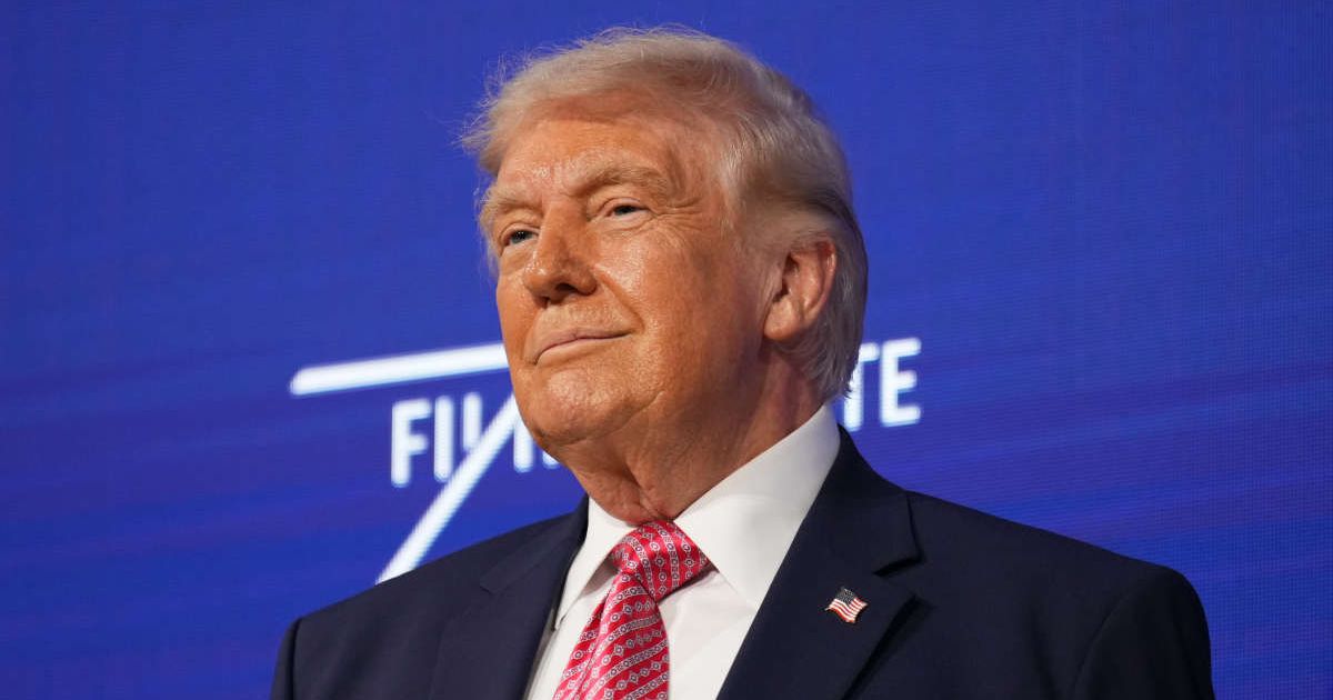 President Donald Trump takes the stage at the Future Investment Initiative Institute's summit, Friday, March 27, 2026, in Miami Beach, Florida (AP Photo/Mark Schiefelbein)