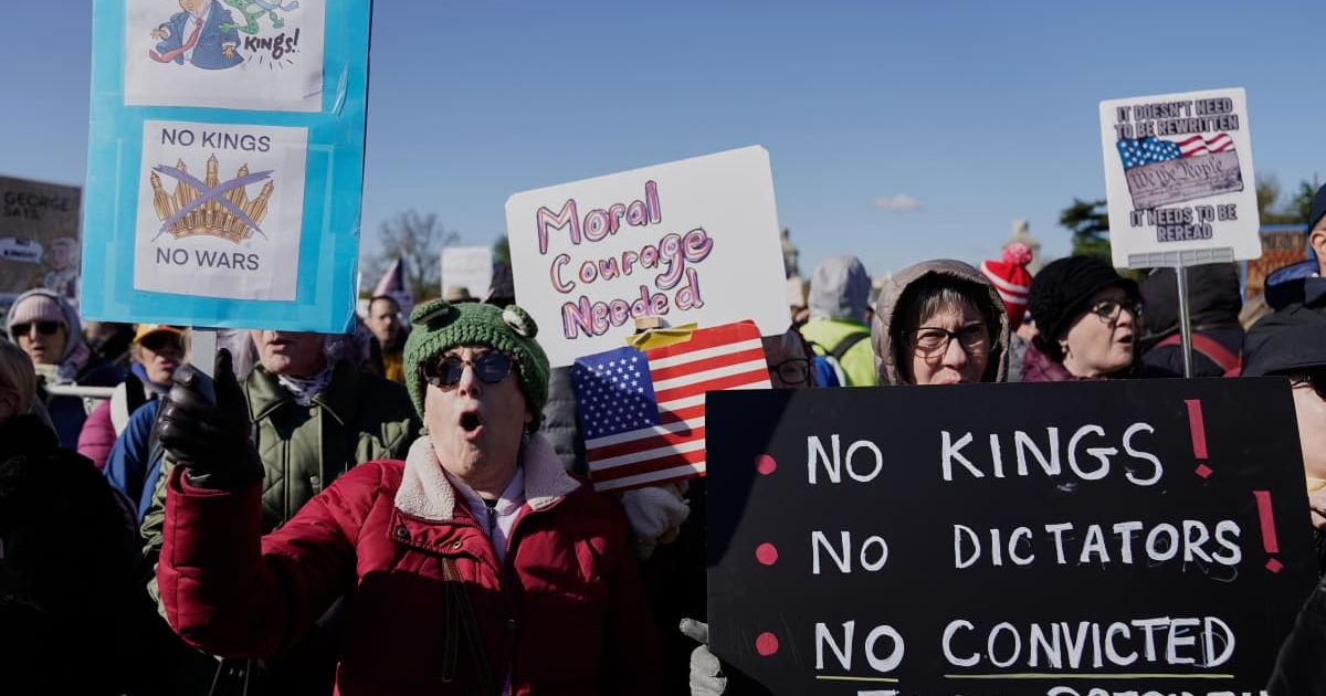 Demonstrators rally before marching across the Memorial Bridge during the 'No Kings' protest in Washington, Saturday, March 28, 2026 (AP Photo/Jose Luis Magana)