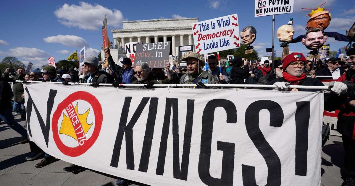 Demonstrators rally in front of the Lincoln Memorial during the No Kings protest in Washington, Saturday, March 28, 2026 (AP Photo/Jose Luis Magana)
