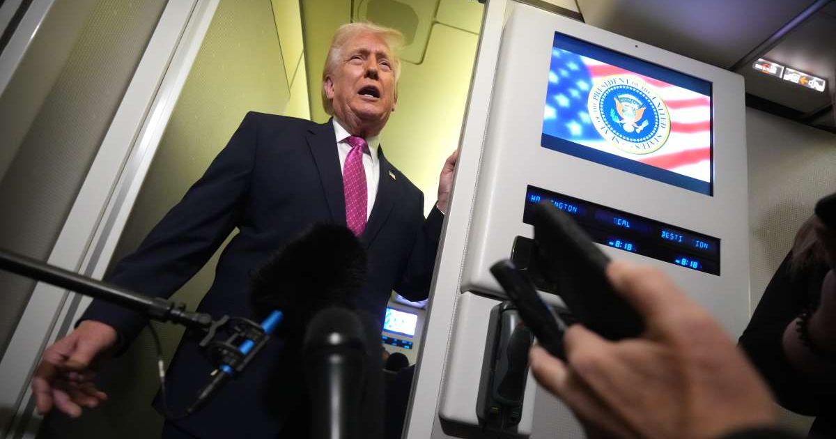 President Donald Trump speaks to reporters aboard Air Force One en route from West Palm Beach, Florida, to Joint Base Andrews, Maryland, on Sunday, March 29, 2026 (AP Photo/Mark Schiefelbein)
