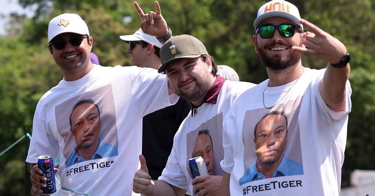 Fans pose for photos while wearing shirts in support of Tiger Woods during the third round of the Texas Children's Houston Open 2026 at Memorial Park Golf Course on March 28, 2026, in Houston, Texas (Mike Mulholland/Getty Images)
