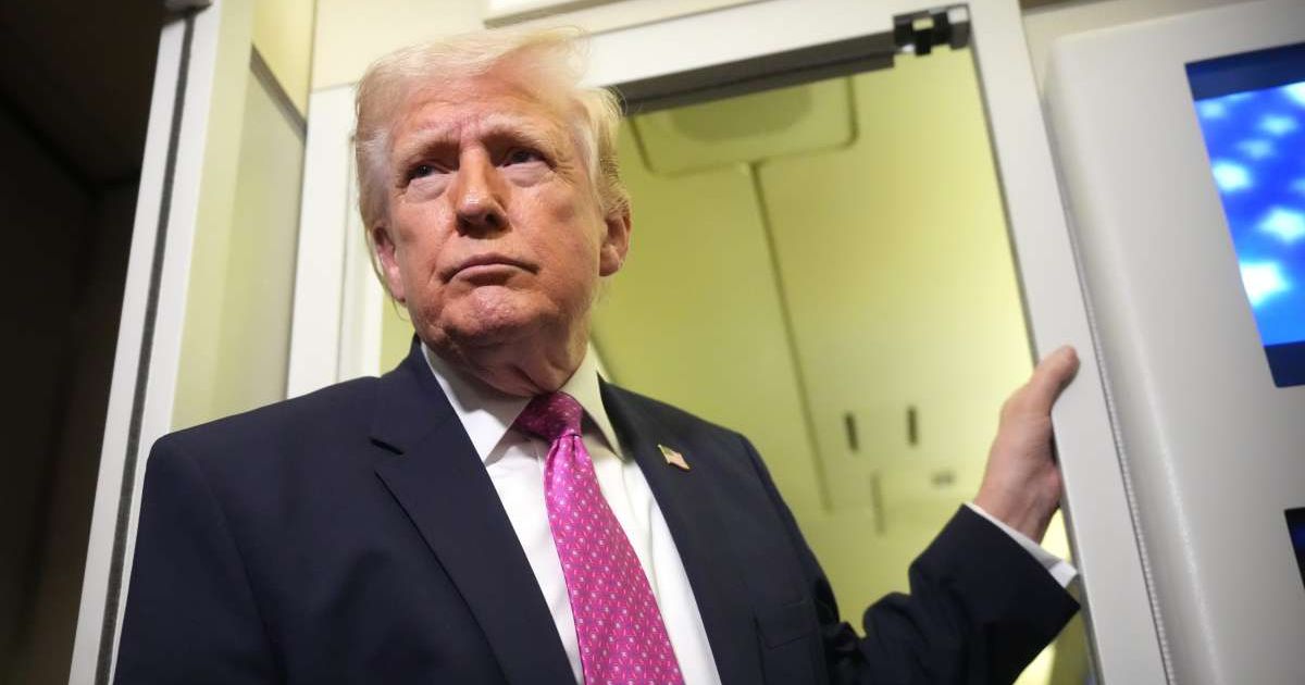 President Donald Trump speaks to reporters aboard Air Force One en route from West Palm Beach, Fla, on March 29, 2026 (AP Photo/Mark Schiefelbein)