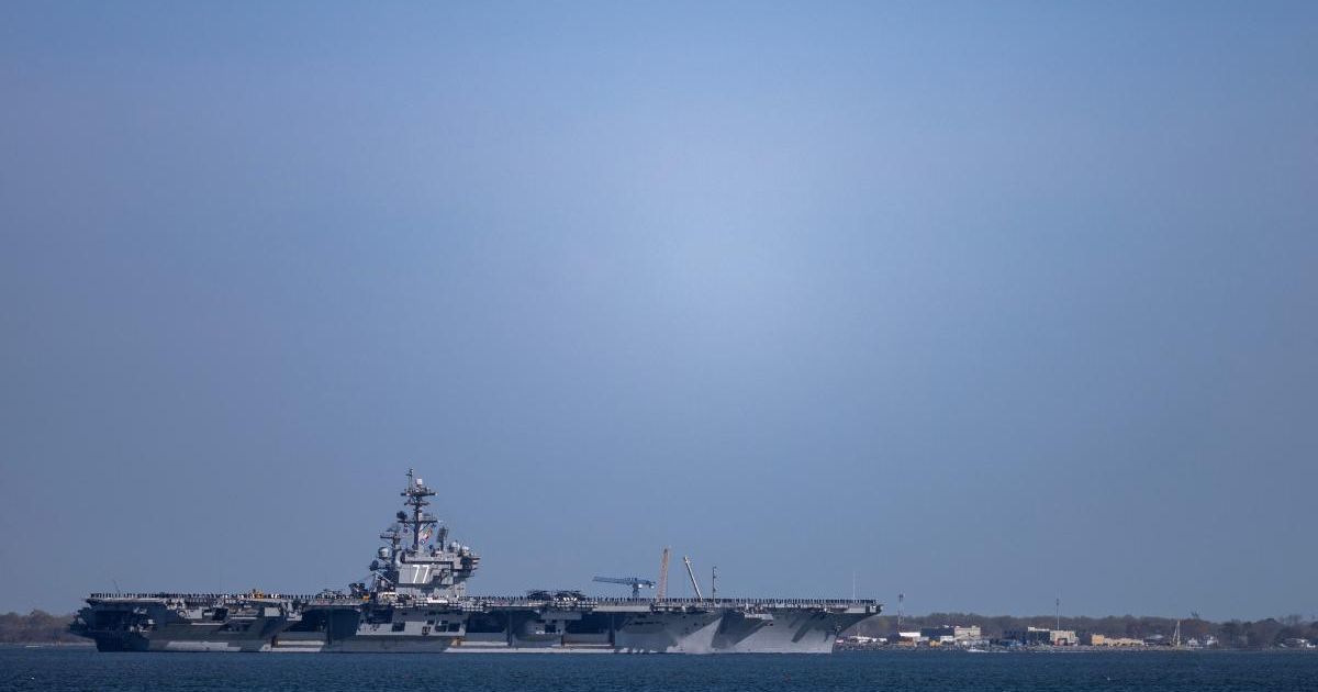 The USS George HW Bush (CVN 77) travels on the James River towards the Hampton Roads Bridge-Tunnel after departing from Naval Station Norfolk in Norfolk, Va for deployment on Tuesday, March 31, 2026 (Kendall Warner /The Virginian-Pilot via AP)