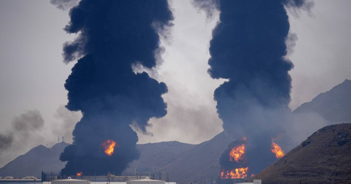 Flames and thick smoke billow from an oil facility in Fujairah, United Arab Emirates, Saturday, March 14, 2026 (AP Photo/Altaf Qadri)