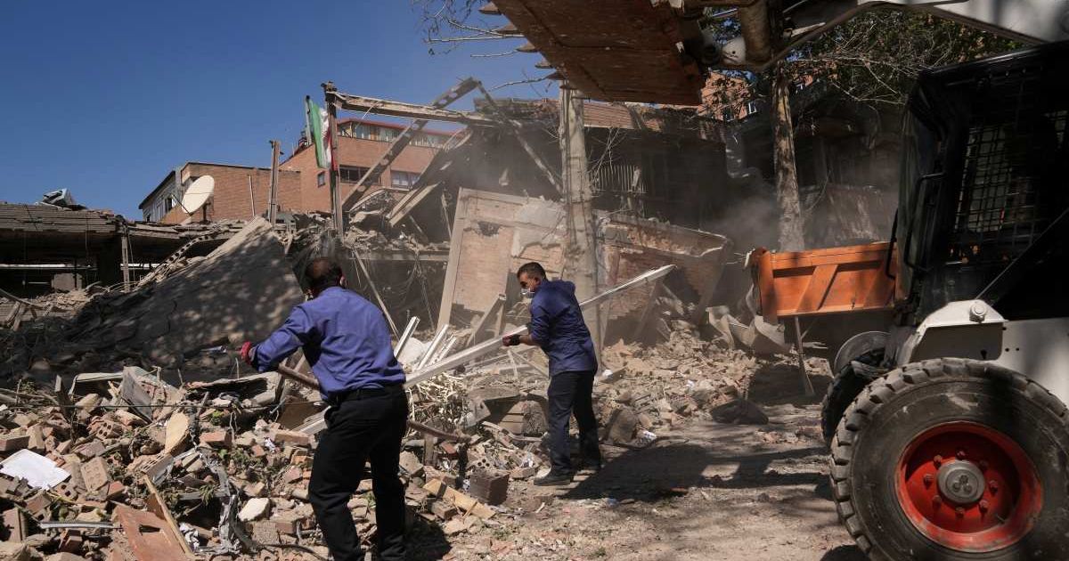 Workers clear debris at Tehran’s Sharif University of Technology, reportedly struck early Monday by a US–Israeli attack, in Tehran, April 6, 2026 (AP Photo/Francisco Seco)