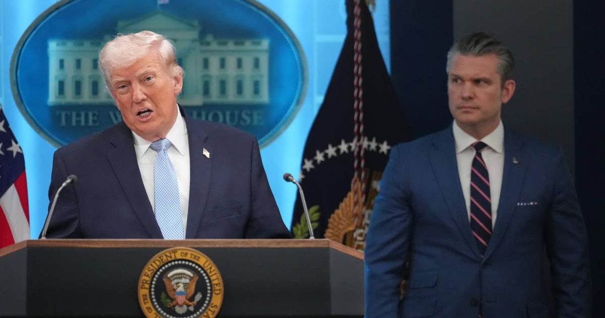 President Donald Trump speaks with reporters in the James Brady Press Briefing Room at the White House, Monday, April 6, 2026, in Washington, as Defense Secretary Pete Hegseth listens (AP Photo/Mark Schiefelbein)