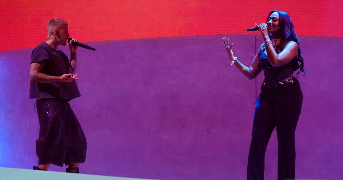 An image of Justin Bieber allegedly getting close with Tems during their Coachella 2026 performance sparked criticism online (Photo by Kevin Mazur/Getty Images for Coachella)