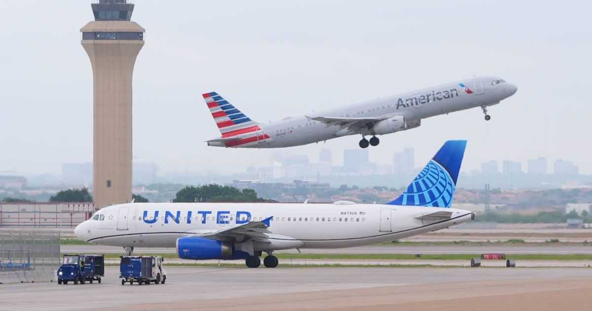 An American Airlines jet takes off as an United Airlines jet taxis at DFW International Airport in Grapevine, Texas, Tuesday, April 14, 2026 (AP Photo/LM Otero)