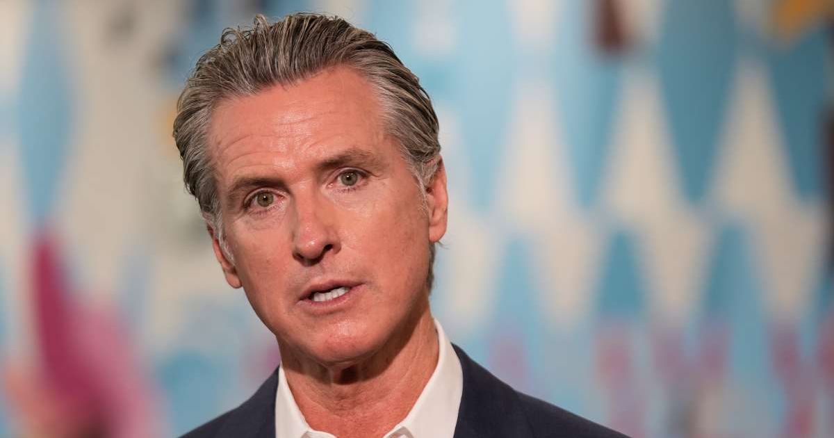 Social media rumors claim California Gov Gavin Newsom reinstated the death penalty for anyone caught investigating fraud (AP Photo/Damian Dovarganes, File)