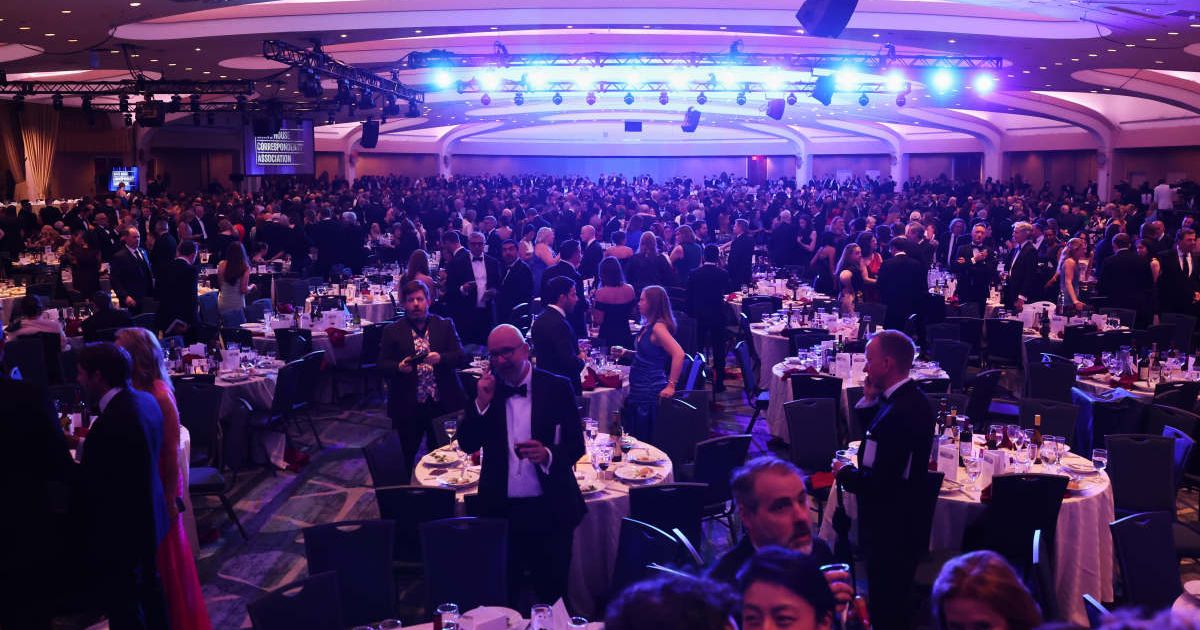 Guests evacuate after an incident at the White House Correspondents Dinner on Saturday, April 25, in Washington (AP Photo/Tom Brenner)