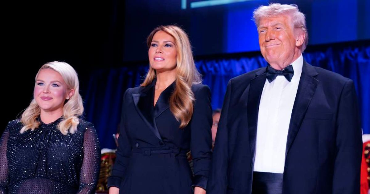 President Donald Trump (pictured alongside First Lady Melania Trump and Karoline Leavitt) says he didn’t stumble when chaos erupted at Saturday’s White House Correspondents’ Dinner (Getty Images)