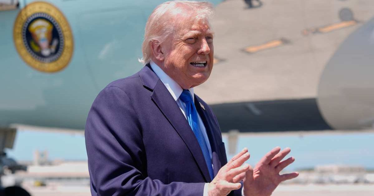 President Donald Trump speaks to reporters before boarding Air Force One at Palm Beach International Airport in West Palm Beach Florida (AP Photo/Manuel Balce Ceneta)