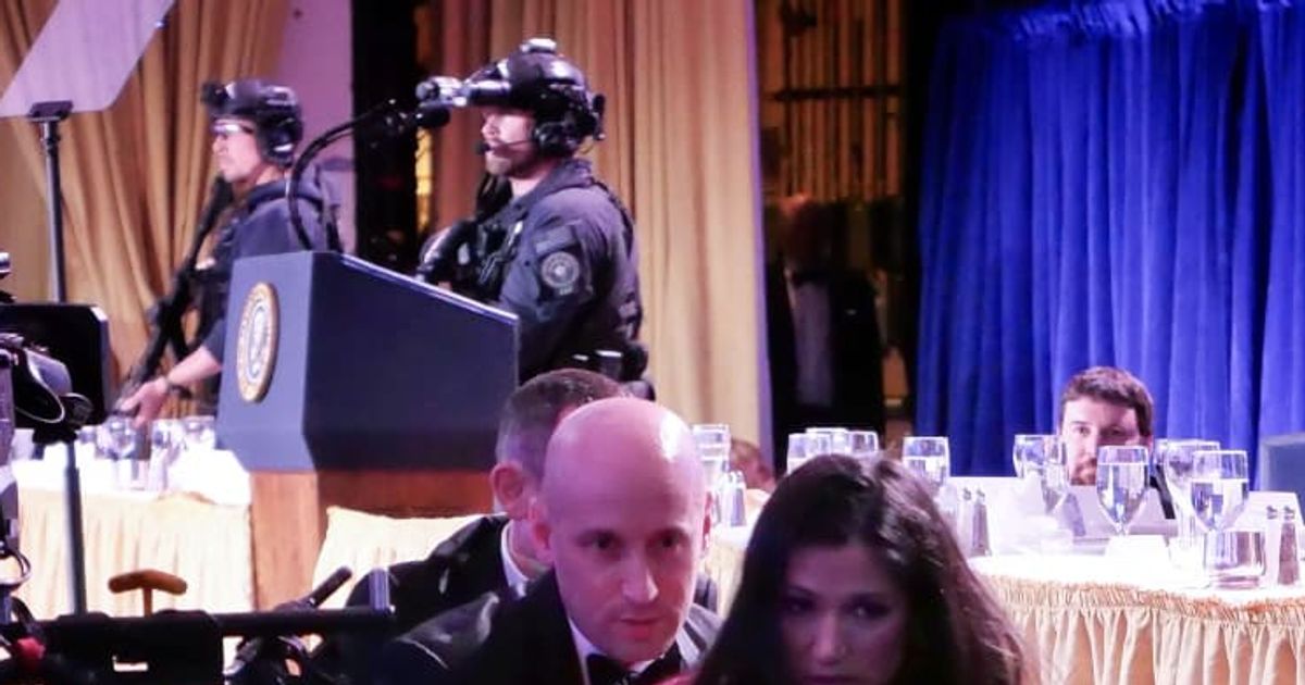 A viral image claims to show Donald Trump standing behind a curtain while Stephen Miller helps his wife Katie Miller after the shooting incident at the annual White House Correspondents’ Dinner (Chip Somodevilla/Getty Images)