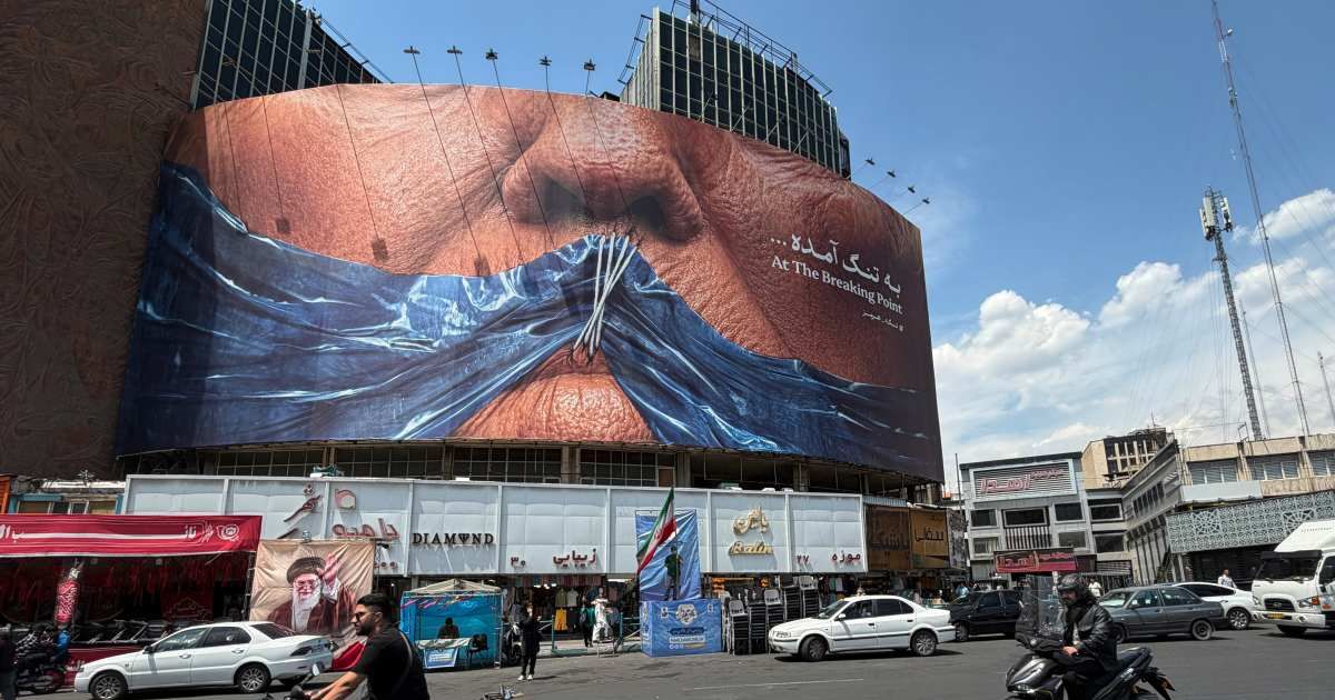 The billboard appeared amid rising United States-Iran tensions, with the Strait of Hormuz, just 21 miles wide, highlighted as a critical global shipping route (AP Photo/Vahid Salemi)